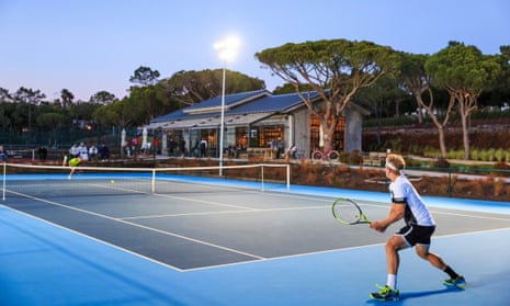 A tennis court and a player at each end