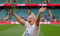 England captain Marlie Packer waves to the crowd holding a red rose