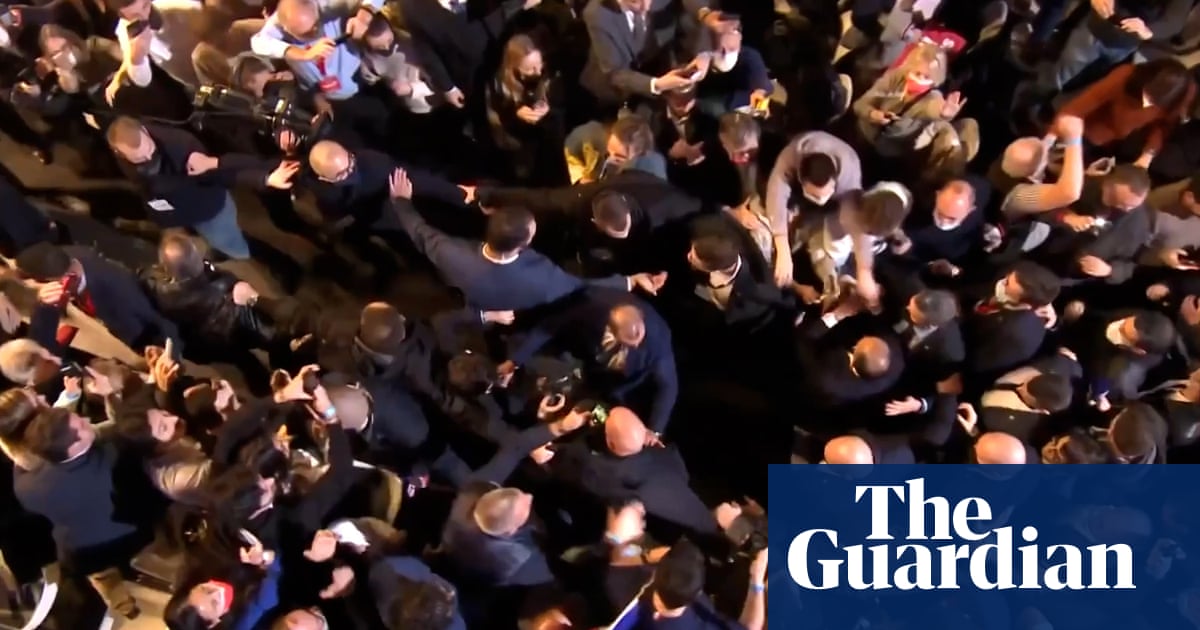 Far-right French presidential candidate put in headlock by protester – video