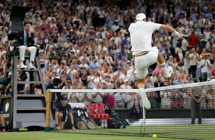 Grigor Dimitrov jumps the net on Centre Court.