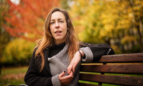 University lecturer and researcher Xanthe Whittaker sitting on a bench