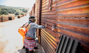 A member of the Kumeyaay band of Indians during a rally at the US-Mexico border to protest construction of new wall on their ancestral grounds on 1 July 2020 in Boulevard, California.