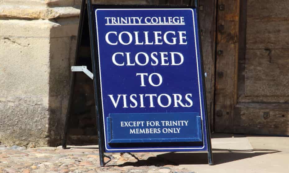 A view of a sign informing the public about the closure of Trinity College, Cambridge