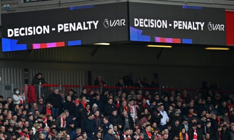 say what you see: The big screens display the news that a VAR (Video Assistant Referee) review has provided Liverpool with a late penalty.