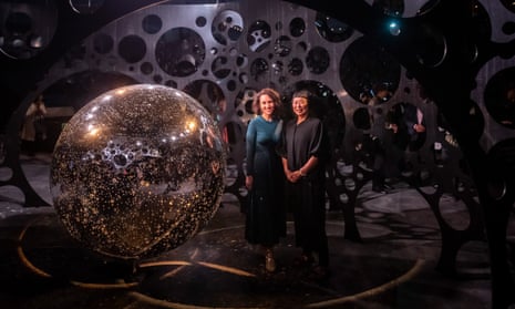 Artist Lindy Lee with Brisbane festival artistic director Louise Bezzina, in front of Lee's sculpture The Spheres, a number of stainless steel spheres with perforations designed to allow light to emulate stars, sunrises and sunsets
