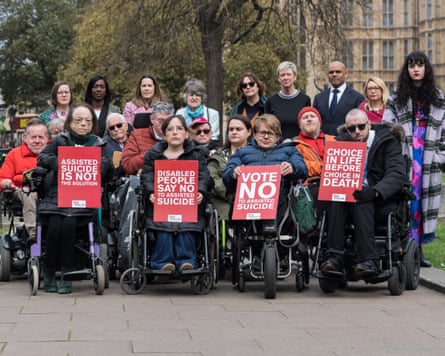 Actor Liz Carr, left, and Baroness Grey-Thompson, third left, with people who oppose assisted dying in 2025