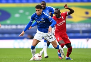 Ben Godfrey with Liverpool’s Sadio Mané on his first appearance for Everton.