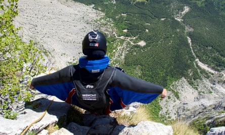 A wingsuit flier about to jump