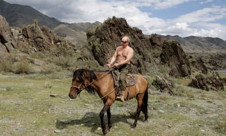 A bare-chested Russian leader Vladimir Putin rides a horse during his vacation outside the town of Kyzyl in Southern Siberia.