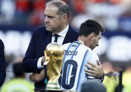 Lionel Messi of Argentina (right) interacts with Victor Montagliani, president of Concacaf, during the awards ceremony after the World Cup 2026 final