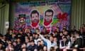 A banner depicting Rob McElhenney and Ryan Reynolds is displayed at the Racecourse Ground