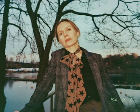 Nina pictured by a lake at dusk