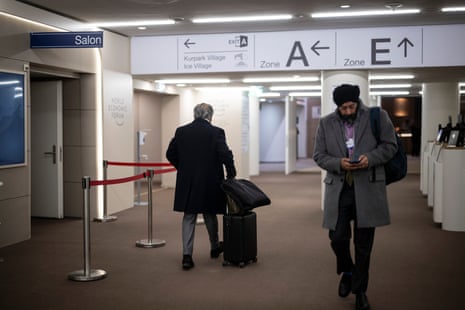 A participant with suitcase leaving the congress center on the closing day of the 56th annual meeting of the World Economic Forum (WEF) in Davos, Switzerland, today