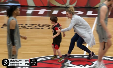 'What's happened here?': Young fan wanders on court to disrupt basketball game – video