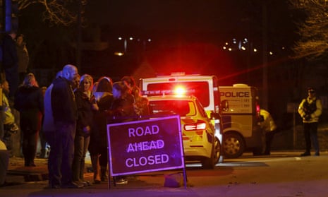 Evacuated residents and emergency personnel are seen at the scene of a collapsed road bridge in Tadcaster.