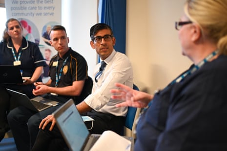 Rishi Sunak listening to Donna Pereira as he meets with a multi-disciplinary team who provide virtual care during a visit to the Rutland Lodge Healthcare Centre in Leeds this morning.