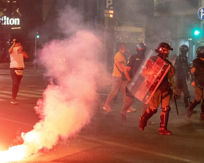 Vučić loyalists clash with anti-government protesters in Serbia – video