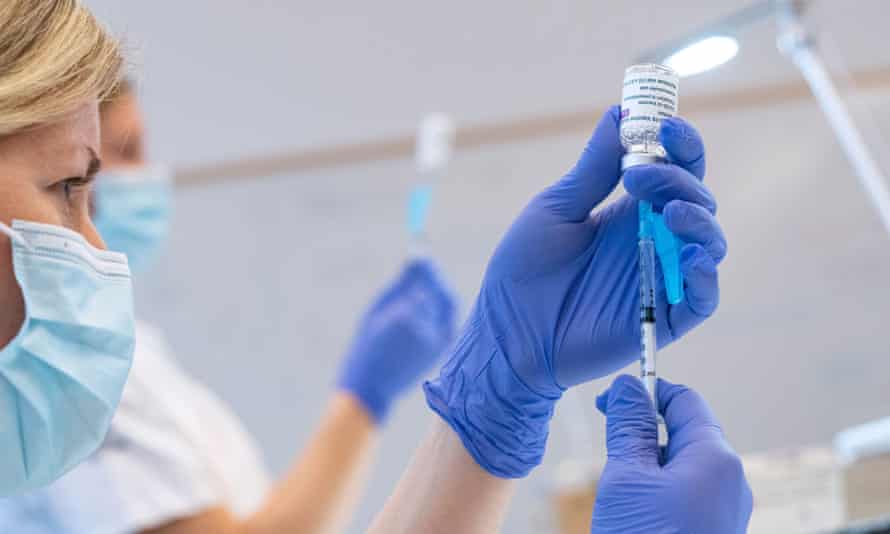 Syringes are loaded with the AstraZeneca Covid vaccine