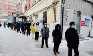 Residents line up for a Covid-19 test following new cases, in Manzhouli. A total of 150 cases have been recorded in the city since 28 November, one of the largest outbreaks in China.