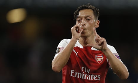 Mesut Ozil celebrates scoring Arsenal’s fourth goal.
