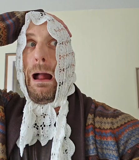 Ben Fensome with a doily on his head, looking appalled