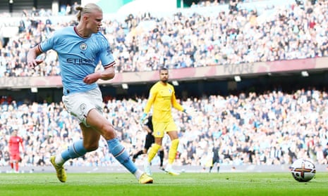Erling Haaland of Manchester City scores the opening goal against Brighton & Hove Albion.