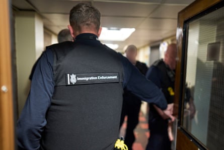 Home Office enforcement officers raiding a flat in Sheffield.