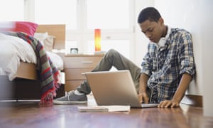 Teen boy using laptop