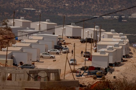 Two dozen white prefabricated houses