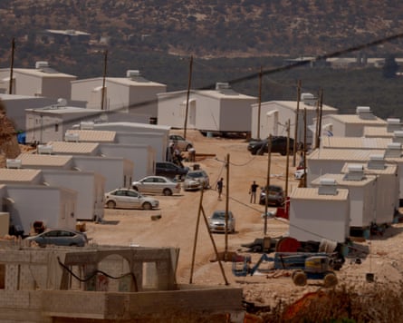 Two dozen white prefabricated houses
