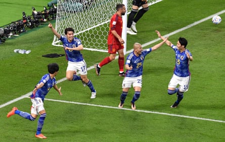 Japan’s Ao Tanaka celebrates scoring their second goal with Kaoru Mitoma, Daizen Maeda and Daichi Kamada.