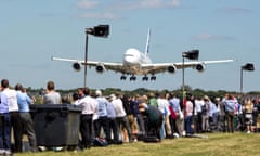Crowds watch an Airbus A380 aircraft on show at Farnborough.