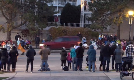 Car drives through crowd at Christmas parade in Waukesha<br>epa09596936 A video grab made available by the City of Waukesha shows a red SUV (C) that reportedly drove through the crowd hitting people at a Christmas parade in Waukesha, Wisconsin, USA, 21 November 2021. According to the Waukesha Police chief Dan Thompson more than 20 people were injured in the incident. EPA/CITY OF WAUKESHA / HANDOUT HANDOUT EDITORIAL USE ONLY/NO SALES