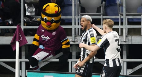 Newcastle United’s Joelinton celebrates scoring their first goal with Lewis Hall.
