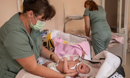Nurses from BioTexCom with newborns for foreign couples.