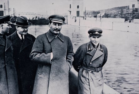 Black and white image of Stalin and Nikolai Yezhov walking along the banks of the Moscow-Volga canal, April 1937