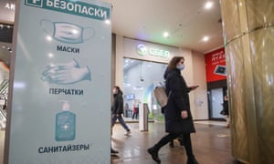 Coronavirus live: UK sees daily cases rise to over 50,000; WHO warns indoor socialising driving infections | World news 7 A sign calling on customers to protect themselves by using face masks, gloves and hand sanitiser, at the Galereya shopping and leisure centre.