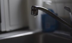 Water drips from a faucet.