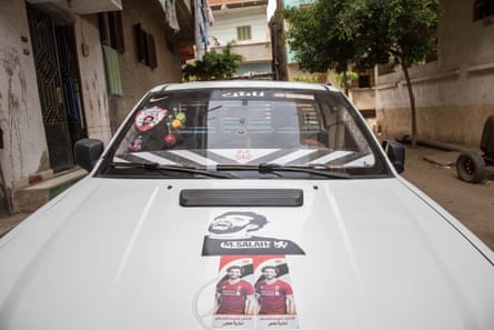 A pickup truck in Nagrig is adorned with images of Salah
