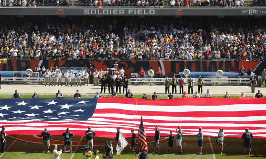 The Pittsburgh Steelers side of the field is nearly empty during the playing of the national anthem at Soldier Field.