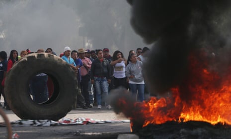 Protesters block the entrance to a Pemex gas station as they burn tires during a protest against the rising prices of gasoline, in San Miguel Totolcingo, Mexico Tuesday.