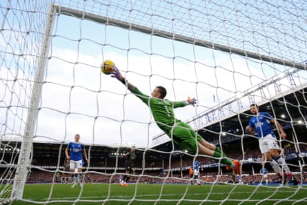 Jordan Pickford of Everton makes a save from a shot by Ollie Watkins of Aston Villa