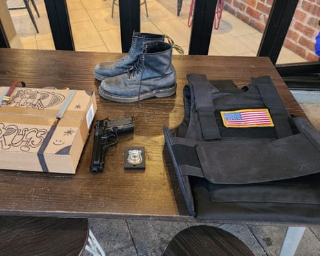 A replica firearm, a bulletproof vest bearing the US flag, a fake police badge and a box with the words ‘Hard Drugs’ written on it have allegedly been seized from Moore Park's Entertainment Quarter in Sydney, NSW
