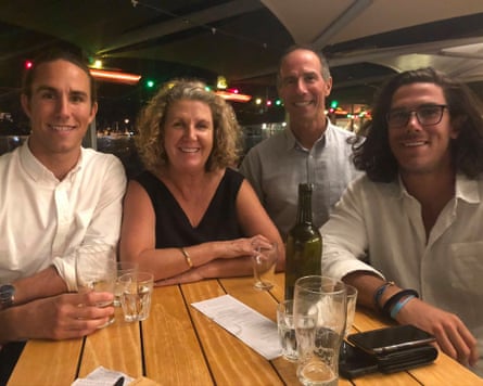 The Robinsons posing for a photo at an outdoor bar table