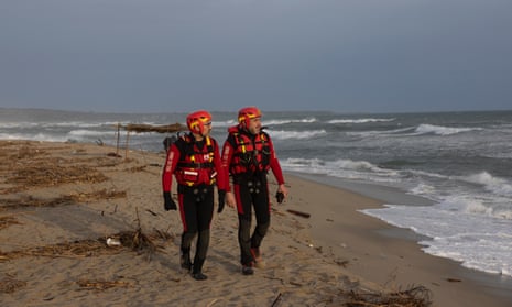 Firefighters and rescue teams on the Steccato di Cutro beach 