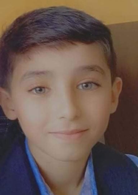 An image of Fadel, showing his head and shoulders. He is smiling at the camera.