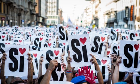 Activists and supporters of gay rights raise a sign to say ‘yes to gay marriage’ at a parade in Milan last month.
