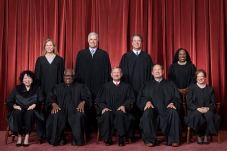 Judges sitting in black robes.