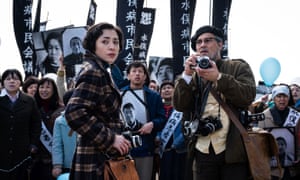 Minami Hinase and Johnny Depp in Minamata.
