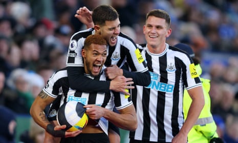 Joelinton of Newcastle United celebrates with teammates after scoring the third goal.